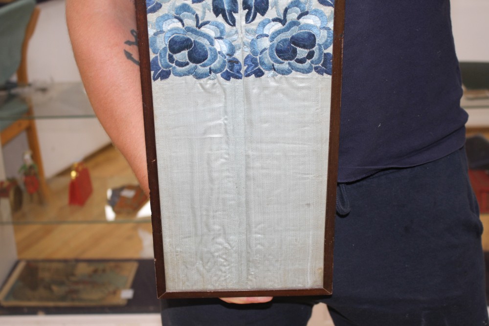 A Chinese silkwork double sleeve panel, 77 x 18cm overall, a smaller floral panel, 61 x 11cm and another, 34 x 26cm overall